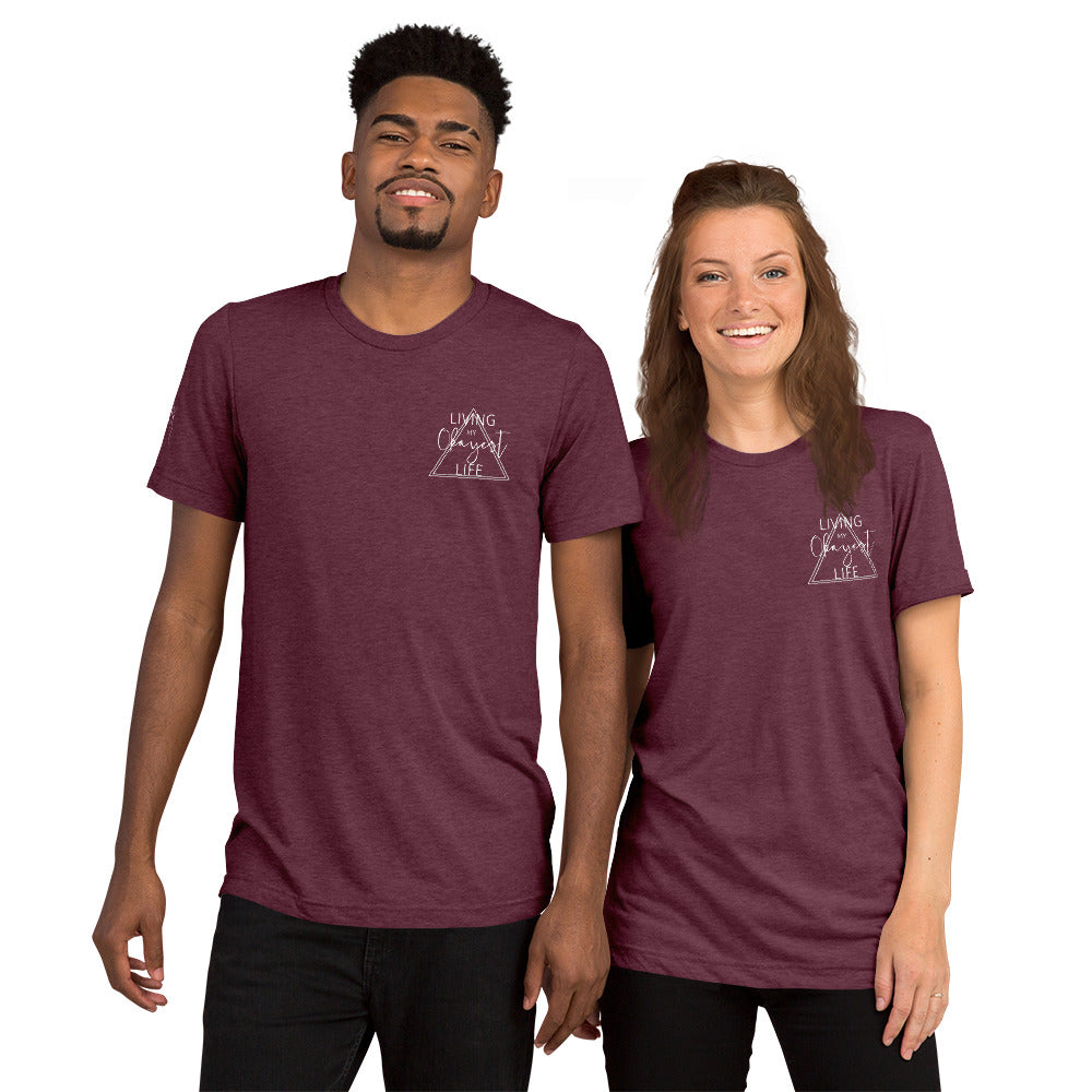 Couple wearing matching maroon Okayest Life t-shirts